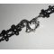 Originele armband met zilverkleurig metalen paard op zwart kant