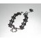 Originele armband met zilverkleurig metalen paard op zwart kant