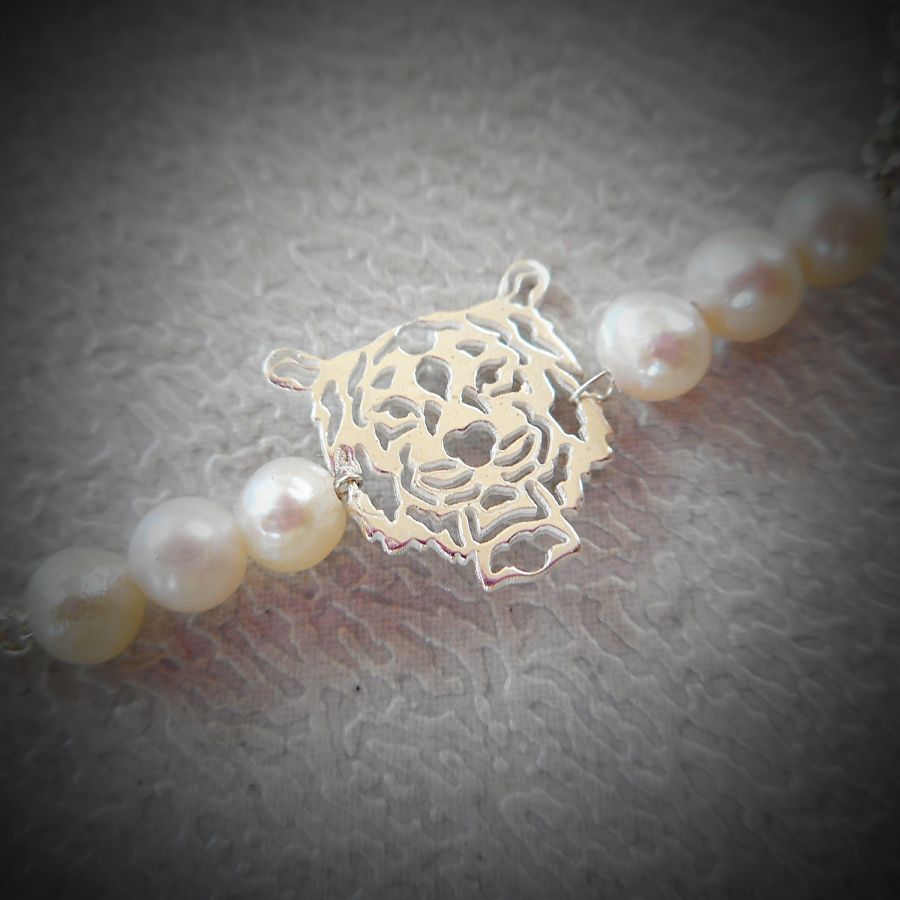 Gekweekte parel en tijger armband aan 925 zilveren ketting